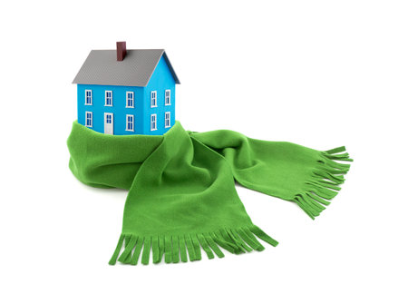 Blue house wrapped in a scarf isolated on whiteの写真素材