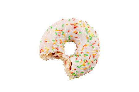 Bitten donut with colorful sprinkles isolated on white with clipping pathの写真素材