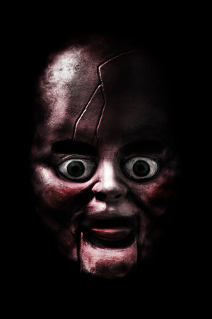 Creepy doll head in the dark