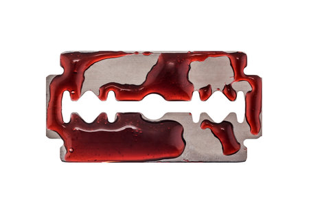 Bloody razor blade isolated on whiteの写真素材