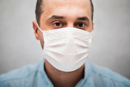 Man wearing protection face mask against coronavirusの写真素材