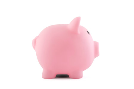 Pink piggy bank isolated on whiteの写真素材