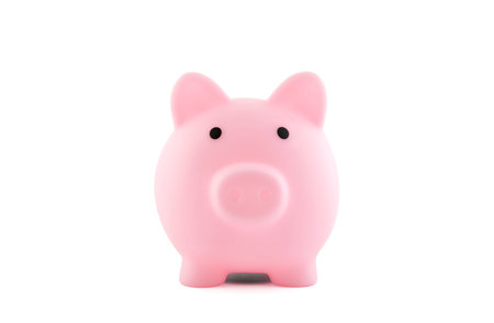 Pink piggy bank isolated on whiteの写真素材