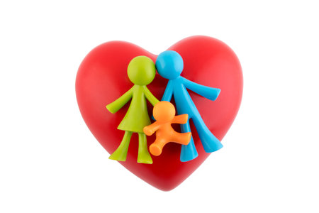 Colorful family figurines with red heart on white background with clipping pathの写真素材