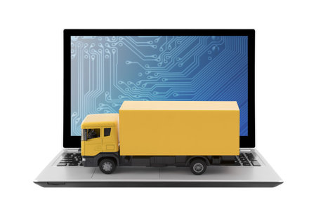 Yellow cargo delivery truck on laptop isolated on white backgroundの写真素材
