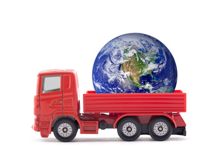Red truck miniature with Planet Earth isolated on white background. Earth photo provided by Nasa.の写真素材