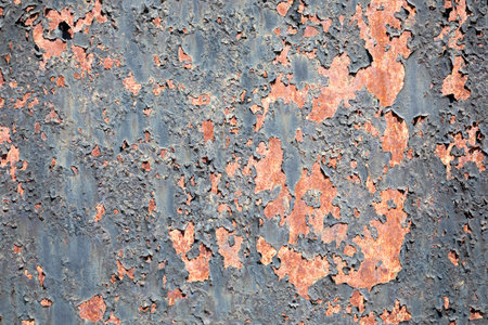 Background texture of scratched rusted steel with peeling paintの写真素材