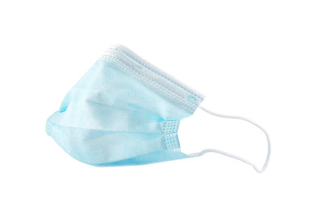 Surgical or medical mask with rubber ear straps against coronavirus isolated on white backgroundの写真素材