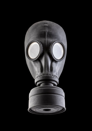 Black gas mask isolated on black background. Environment pollution.の写真素材
