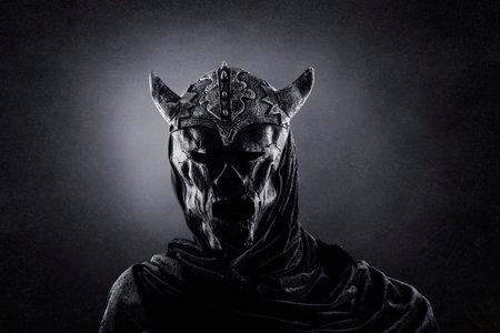 Demon with horned helmet in the darkの写真素材