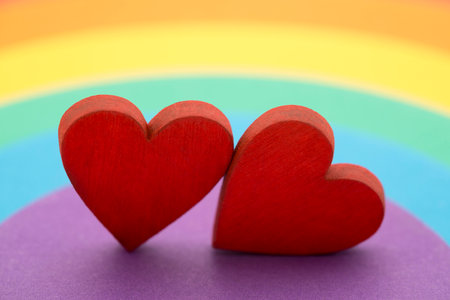 Two hearts on a colorful rainbow backgroundの写真素材