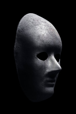Black mask isolated on black backgroundの写真素材