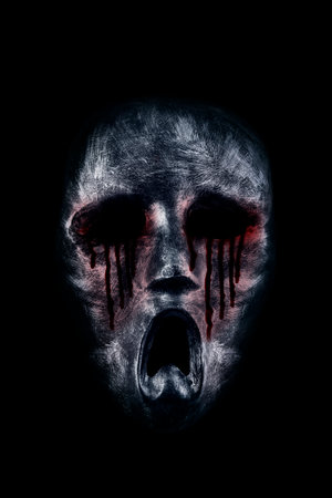 Creepy bloody ghost head isolated on black backgroundの写真素材