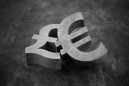 Pair of vintage pound and euro symbolsの写真素材
