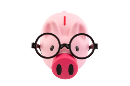 Piggy bank with black glasses isolated on white background with clipping pathの写真素材