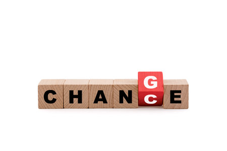 Wooden blocks with the words Change or Chance on white backgroundの写真素材