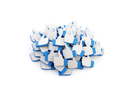 Many blue like thumb up icons on white backgroundの写真素材