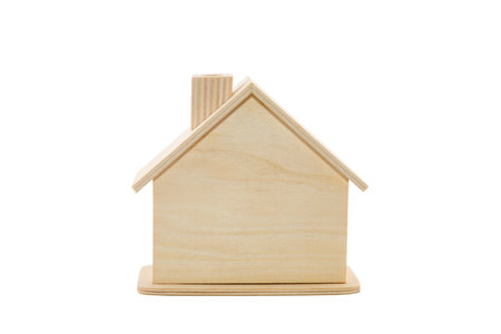 Wooden house shape isolated on white backgroundの写真素材