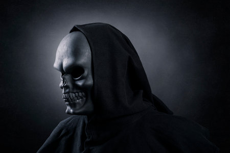 Grim reaper over dark misty backgroundの写真素材