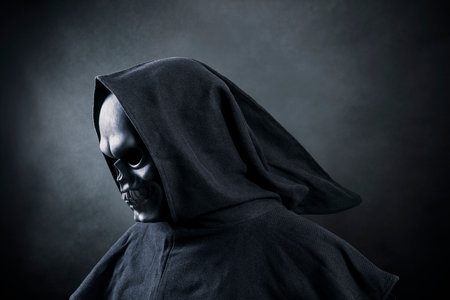 Grim reaper over dark misty backgroundの写真素材