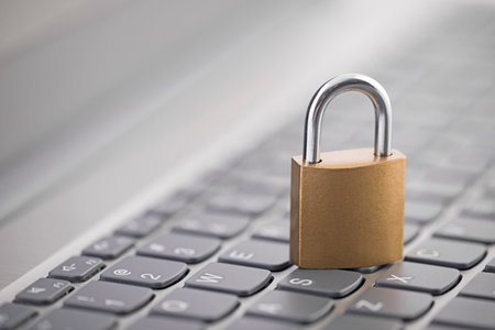 Security concept with metal padlock on computer keyboardの写真素材