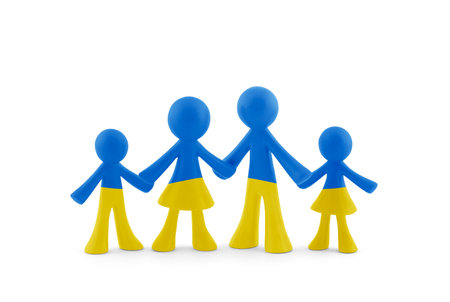 Family figurines with the colors of the Ukrainian flag on white background with clipping pathの写真素材