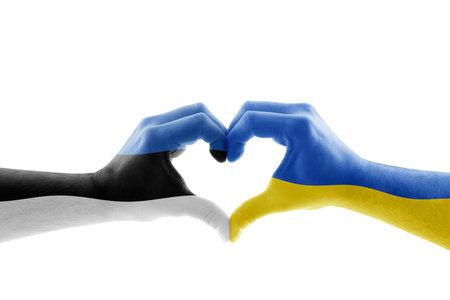 Two hands in the form of heart with Estonian and Ukrainian flag isolated on white backgroundの写真素材