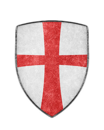 Old metal crusaders shield with red cross isolated on white backgroundの写真素材