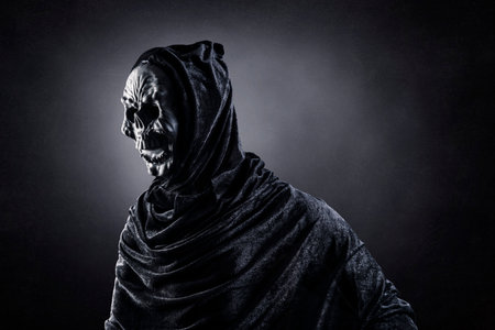 Grim reaper over dark misty backgroundの写真素材