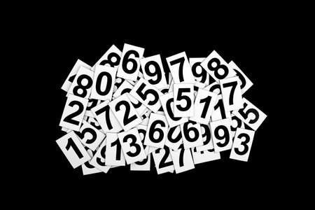 Abstract background with random numbers isolated on black background. Typography background composition.の写真素材