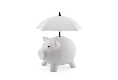 financial insurance. White piggy bank with umbrella isolated on white background with clipping pathの写真素材