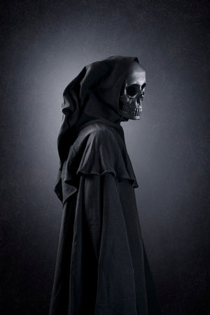 Grim reaper over dark misty backgroundの写真素材