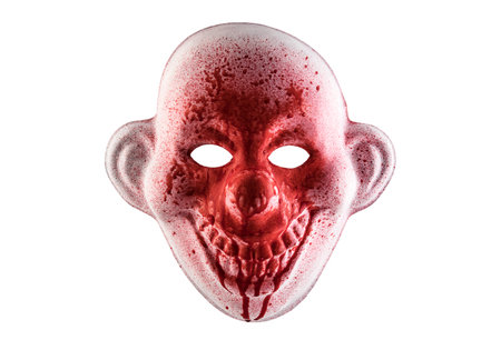 Scary clown halloween mask in blood isolated on white background with clipping pathの写真素材