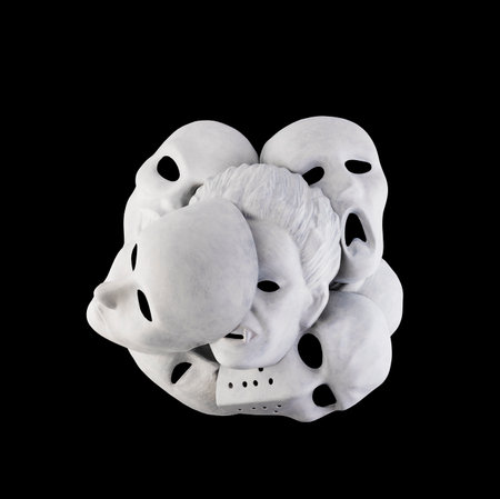 Group of white creepy masks isolated on black background with clipping pathの写真素材