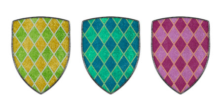 Old decorated colorful metal shields isolated on white backgroundの写真素材