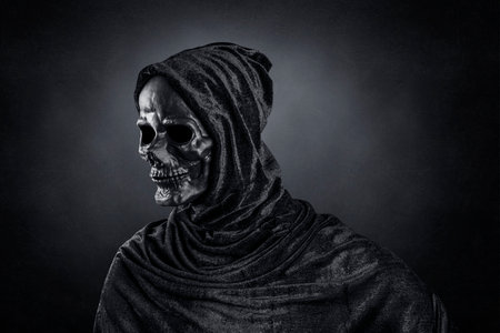 Grim reaper over dark misty backgroundの写真素材