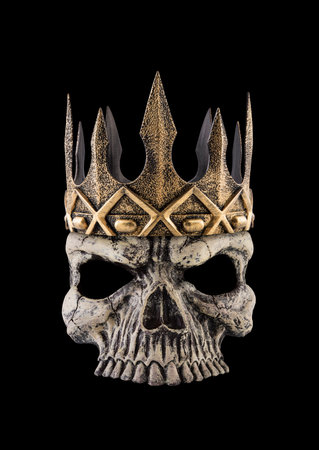 Human skull with ancient golden crown isolated on black backgroundの写真素材