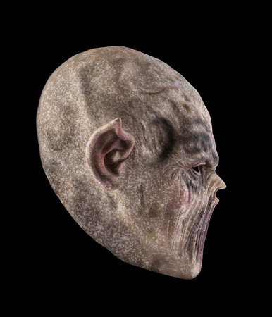 Monster head isolated on black background with clipping pathの写真素材