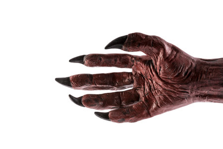 Red devil monster hand isolated on white background with clipping path