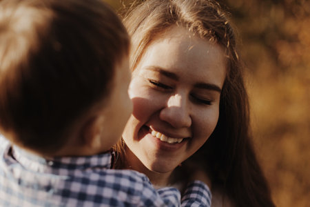Funny couple toghether with a smile. Happy young family in forest.の写真素材