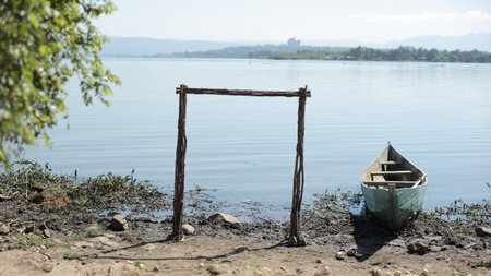 Beautiful landscape of the boat on the shore of the sea. Calm sunny day in Africa.の写真素材