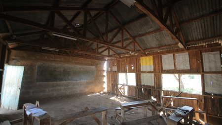 African school. Small poor village, pupils sitting at the tables.の写真素材