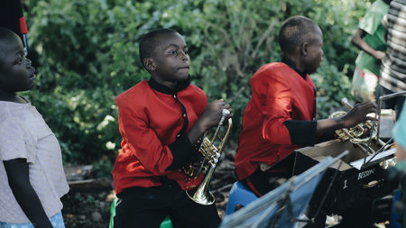 KENYA, KISUMU - MAY 20, 2017: Close-up view of african musical band, group is playing, give a concert outside.のeditorial素材
