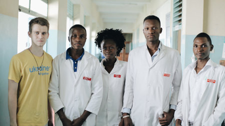 KENYA, KISUMU - MAY 20, 2017: Young beautiful people, women and man in white gown in African hospital.のeditorial素材