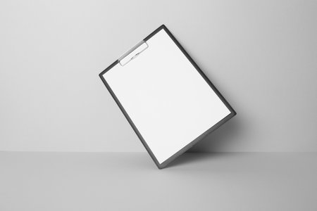 Clipboard with blank A4 paperの写真素材