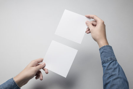 Hand holding Blank Square / Invitation Mock-up.の写真素材