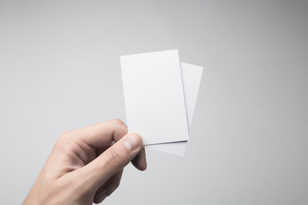Hand holding Blank Business Cards Mock-up.の写真素材