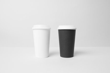 Black and white paper cup mockupの写真素材