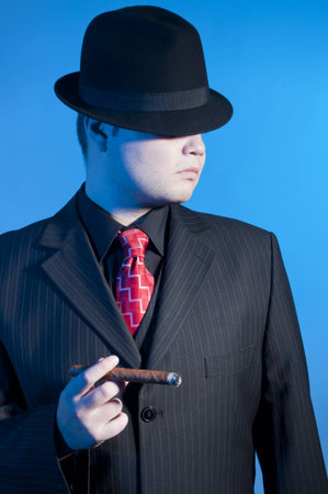 elegant gangster dressed in a black suitの写真素材