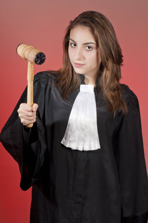 Young law school student holding a law hammerの写真素材